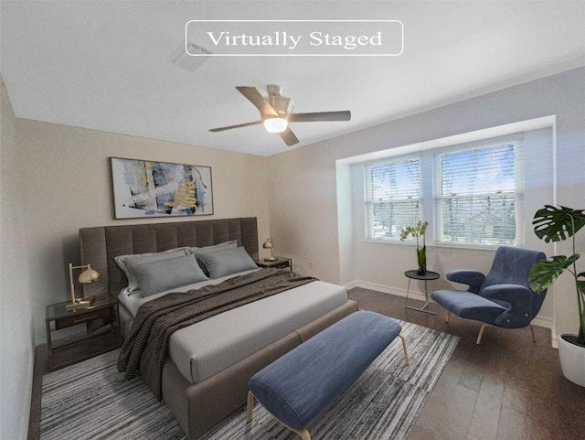 bedroom featuring dark hardwood / wood-style floors and ceiling fan