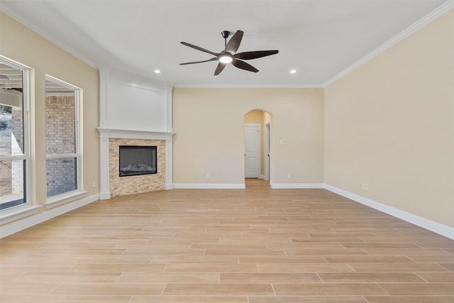 unfurnished living room with ceiling fan, crown molding, and light hardwood / wood-style flooring