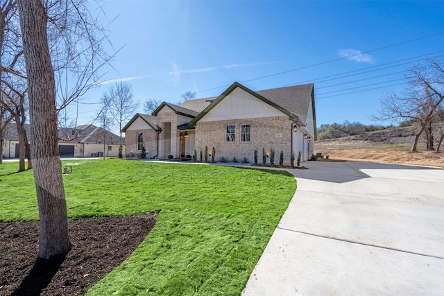 view of front of property with a front yard and a garage