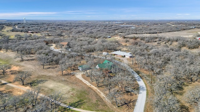 birds eye view of property with a rural view