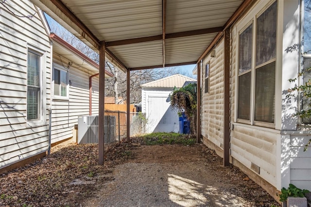 view of yard featuring central air condition unit and an outdoor structure