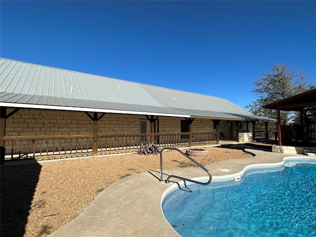 view of swimming pool with a patio