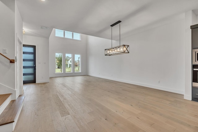 unfurnished living room featuring light wood-type flooring