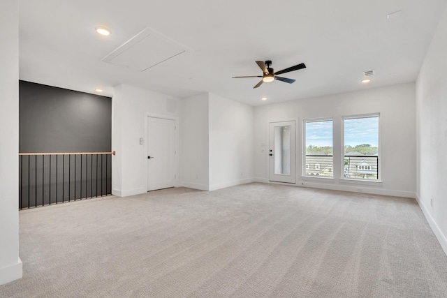 unfurnished room with ceiling fan and light colored carpet