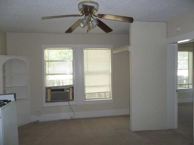 interior space with ceiling fan and a textured ceiling