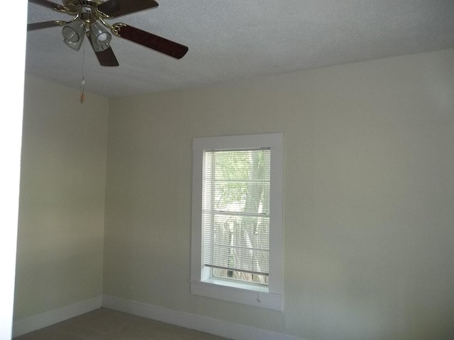 unfurnished room featuring ceiling fan