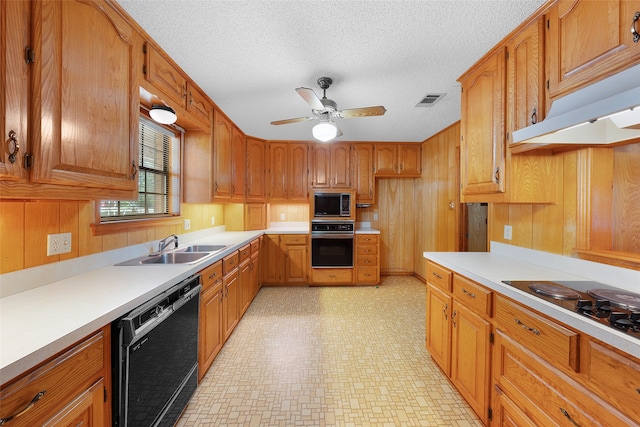 kitchen featuring black appliances, ceiling fan, sink, and a textured ceiling