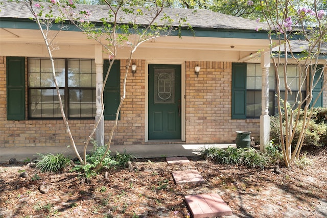 doorway to property with covered porch