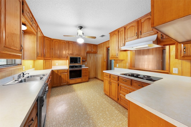 kitchen with ceiling fan, a textured ceiling, sink, and black appliances