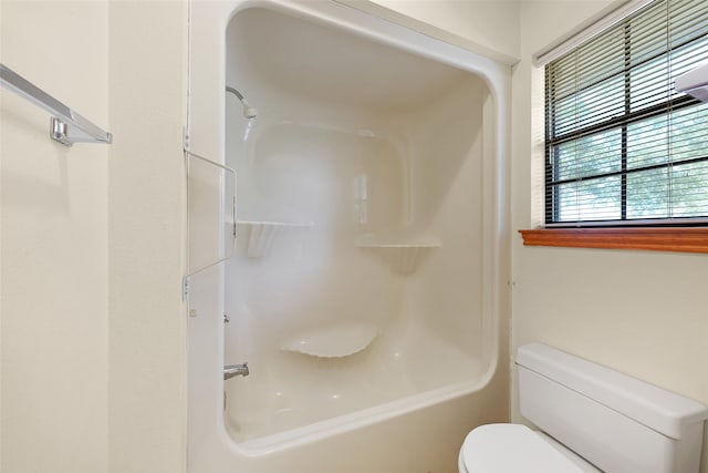 bathroom with shower / tub combination and toilet