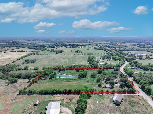 birds eye view of property featuring a rural view