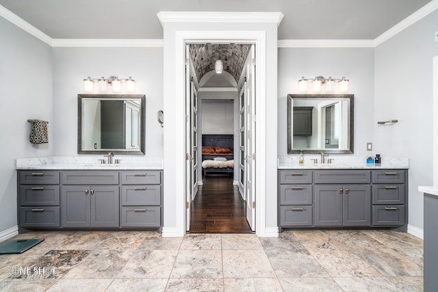 bathroom with backsplash, crown molding, and vanity