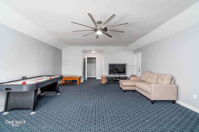 playroom featuring ceiling fan, lofted ceiling, and dark colored carpet