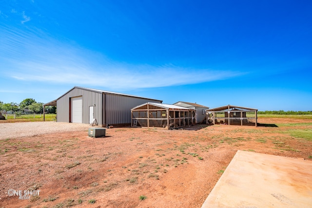 view of yard with an outbuilding and a garage