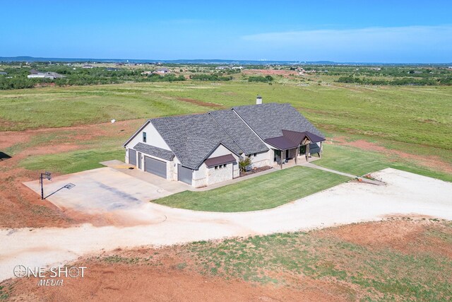 birds eye view of property featuring a rural view
