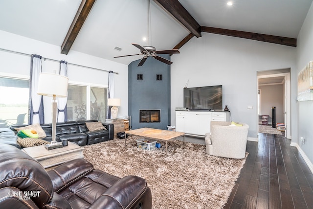 living room featuring dark hardwood / wood-style flooring, ceiling fan, beam ceiling, high vaulted ceiling, and a fireplace