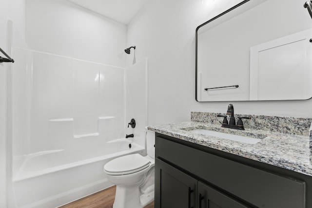 full bathroom featuring vanity, shower / bathtub combination, toilet, and wood-type flooring