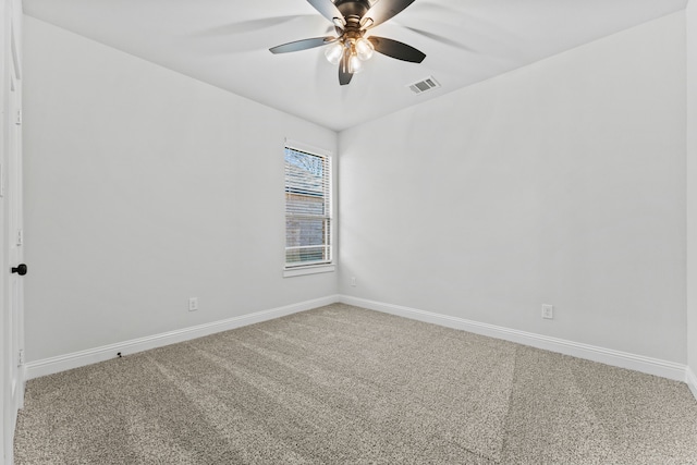 spare room with ceiling fan and carpet floors