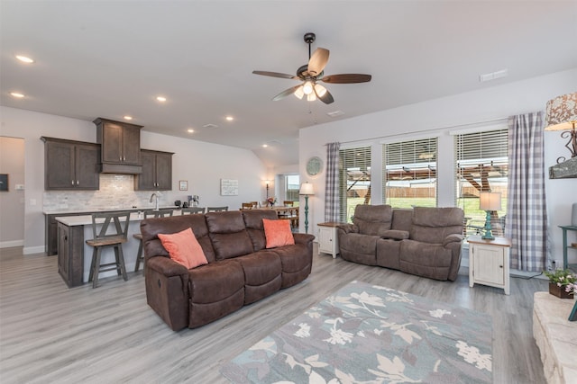 living room featuring light wood finished floors, recessed lighting, visible vents, ceiling fan, and baseboards