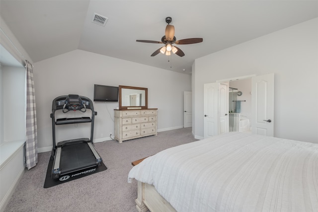 bedroom with ceiling fan, lofted ceiling, carpet floors, and connected bathroom