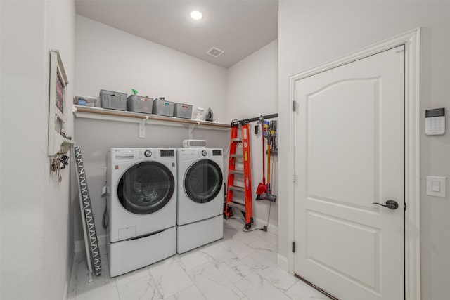 laundry room featuring washer and clothes dryer