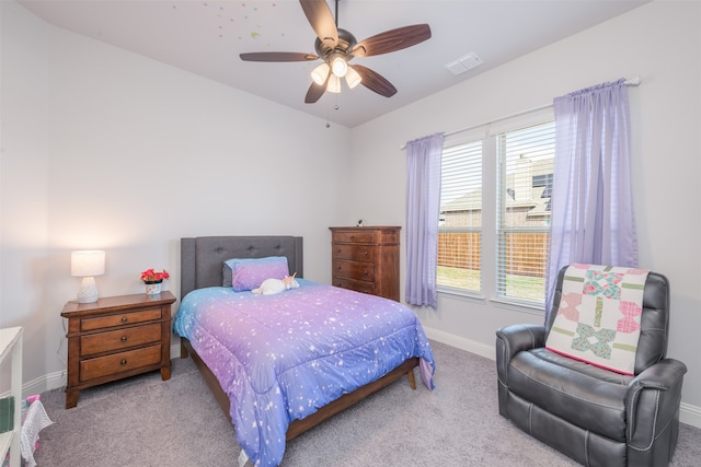 bedroom with light colored carpet and ceiling fan