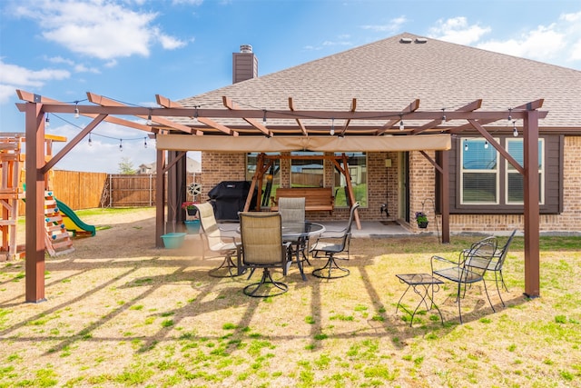 view of patio featuring a pergola, area for grilling, and a playground