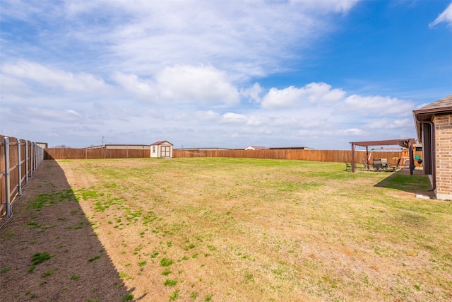 view of yard with a storage shed