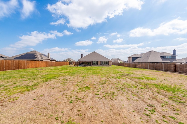 view of yard with a fenced backyard