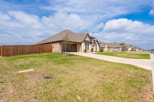 view of front of home with a garage and a front yard