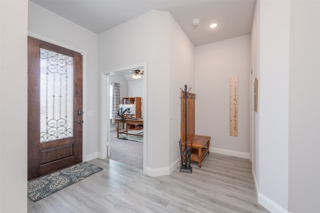 foyer featuring light hardwood / wood-style floors and ceiling fan