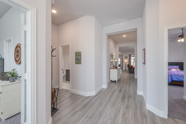 corridor featuring light hardwood / wood-style floors