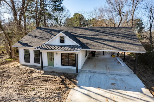 modern inspired farmhouse with a carport