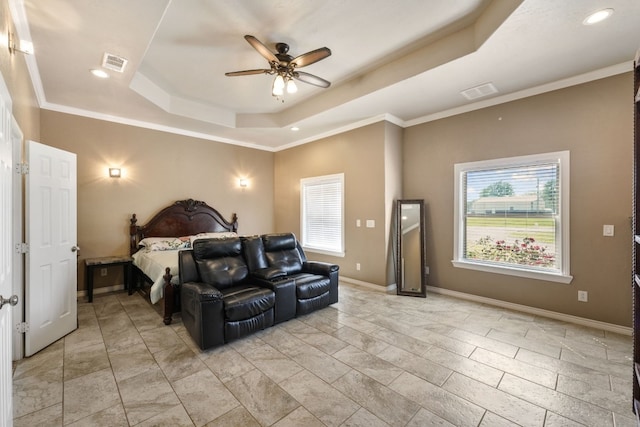 bedroom with ceiling fan, crown molding, a tray ceiling, and light tile floors