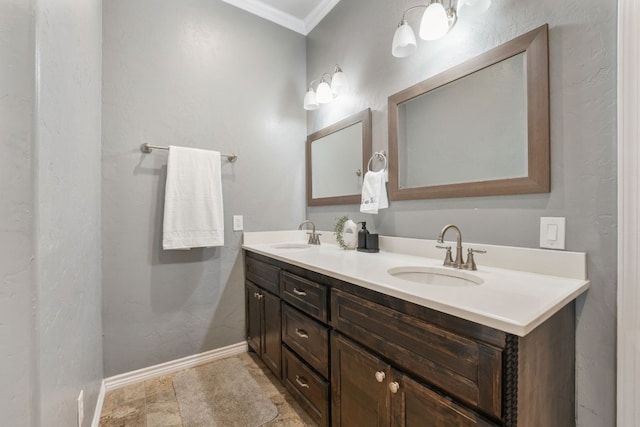 bathroom featuring ornamental molding, tile floors, and dual bowl vanity