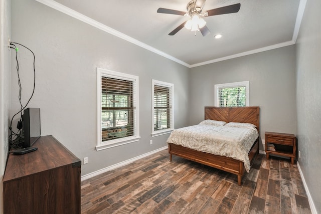 bedroom featuring ceiling fan, dark wood-type flooring, and ornamental molding