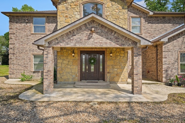 doorway to property with a porch