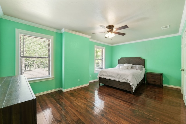 bedroom featuring ceiling fan, dark hardwood / wood-style flooring, and ornamental molding