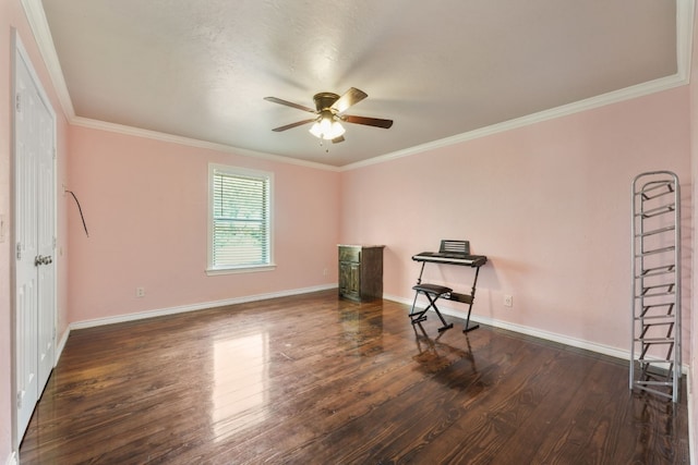 empty room with dark hardwood / wood-style flooring, ceiling fan, and ornamental molding