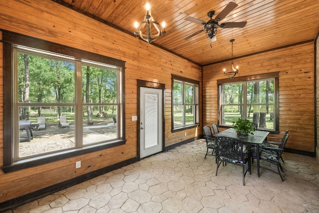 sunroom with wooden ceiling, ceiling fan with notable chandelier, and a healthy amount of sunlight