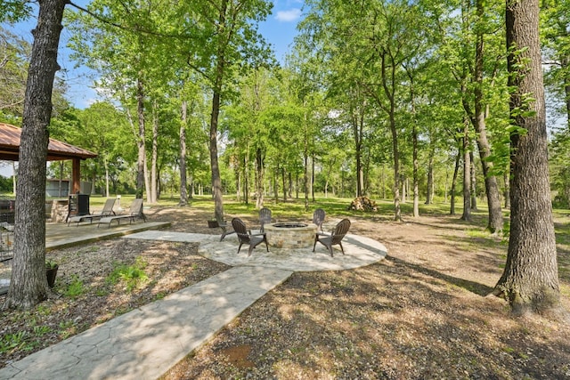 view of nearby features with a patio area, a fire pit, and a gazebo