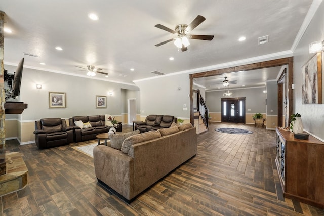 living room with ceiling fan, crown molding, and dark parquet floors