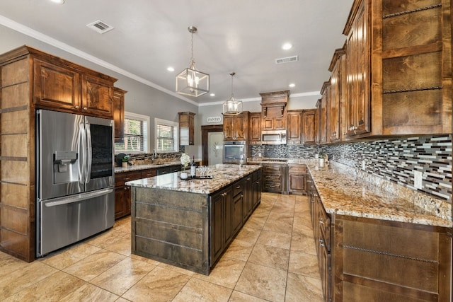 kitchen featuring a kitchen island with sink, light stone counters, crown molding, appliances with stainless steel finishes, and backsplash