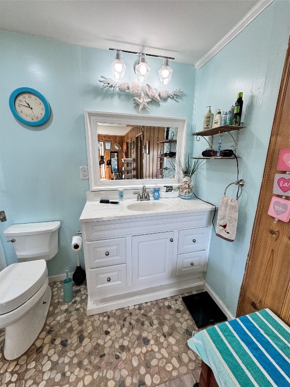 bathroom with vanity, tile floors, and toilet