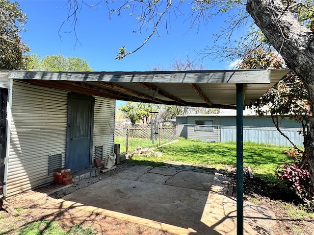 view of vehicle parking with a carport and a yard