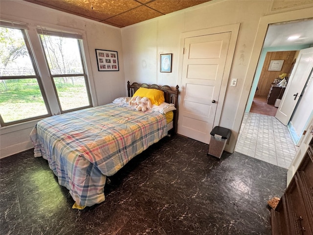 tiled bedroom with multiple windows