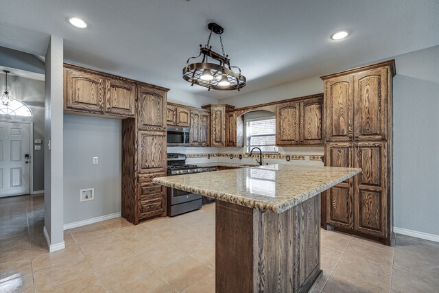 kitchen with ceiling fan, light tile patterned floors, a center island, and french doors