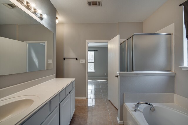 bathroom featuring separate shower and tub and tile patterned flooring