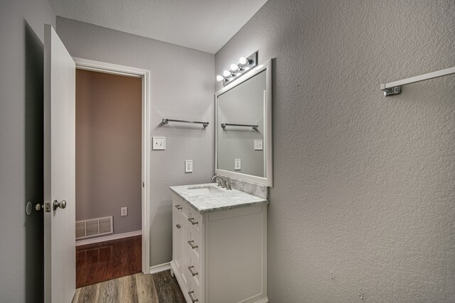 bathroom featuring vanity, toilet, and tile patterned flooring