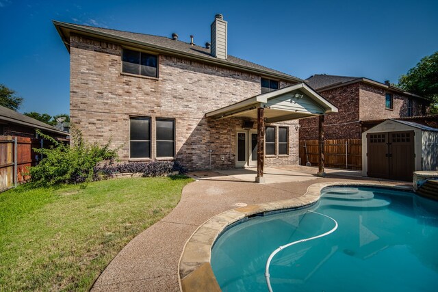 view of swimming pool with an in ground hot tub and a patio area